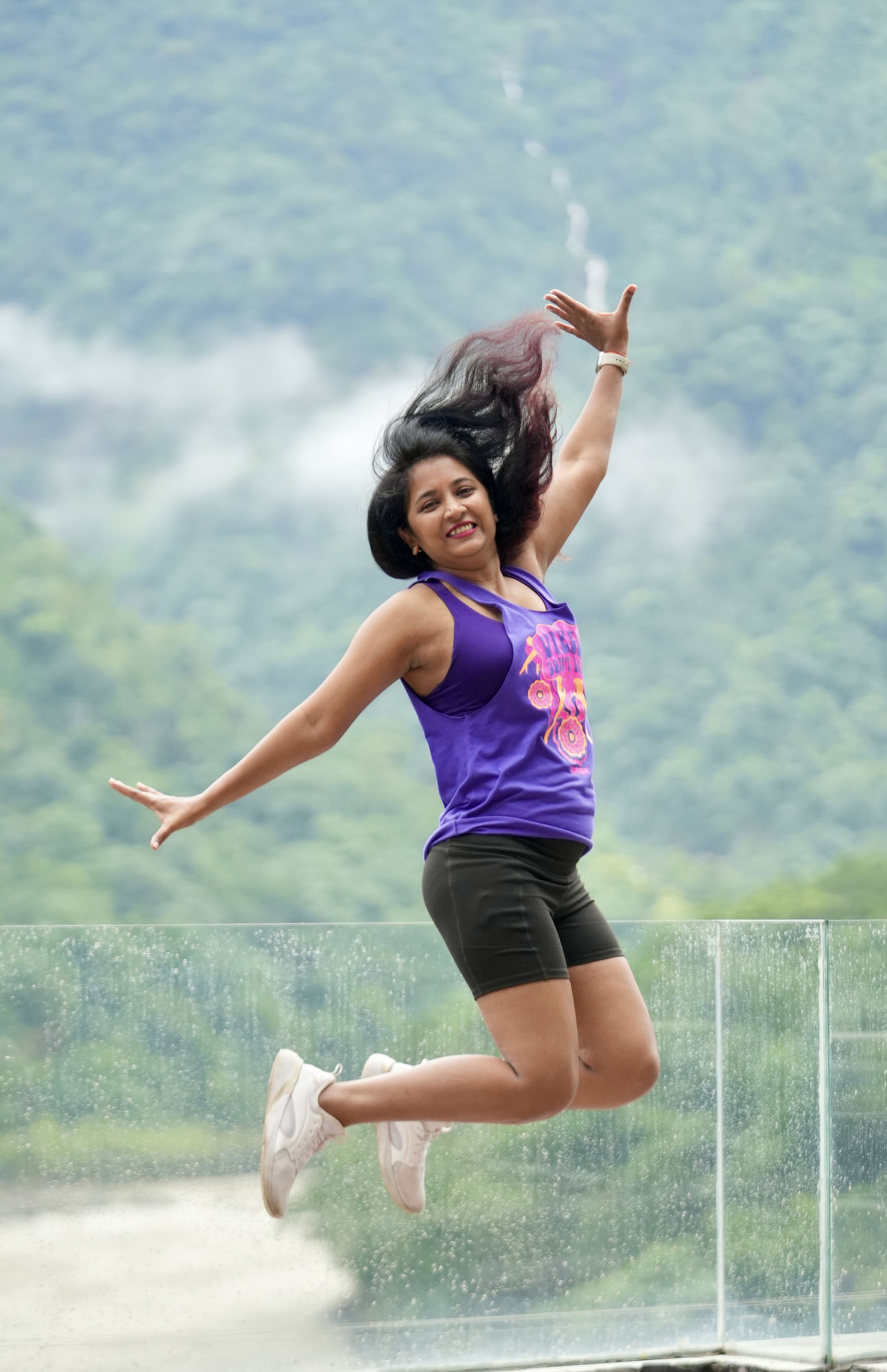 Neha Joshi mid-jump in a Zumba session